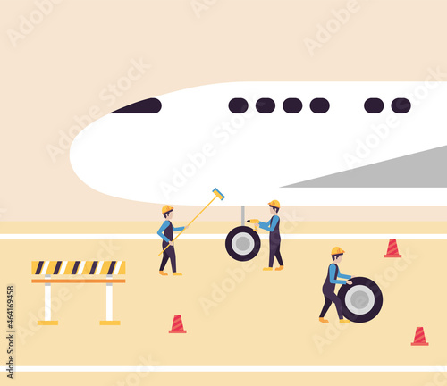 airline workers checking airplane