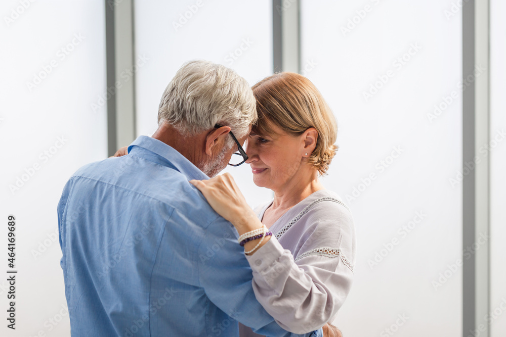 Senior couple dancing in living room, Elderly woman and a man dancing, Happy family concepts Senior couple dancing in living room, Elderly woman and a man dancing, Happy family concepts