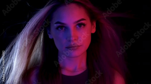 Blowing hair Portrait woman move colorful neon led light. Glamour face fashion ultraviolet illuminance. Luxury motion hair wind air girl led lighting. Style blow colors neon illumination ultra violet.