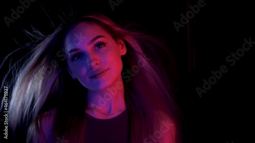 Blowing hair Portrait woman move colorful neon led light. Glamour face fashion ultraviolet illuminance. Luxury motion hair wind air girl led lighting. Style blow colors neon illumination ultra violet.