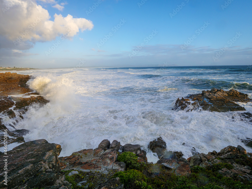 Large ocean swells crashing into rocky shoreline at Siever's Point. Hermanus. Whale Coast. Overberg. Western Cape. South Africa