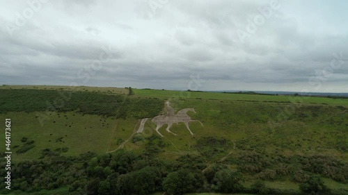 Osmington White Horse legendary chalk figure art on hillside slope aerial view rising above countryside photo