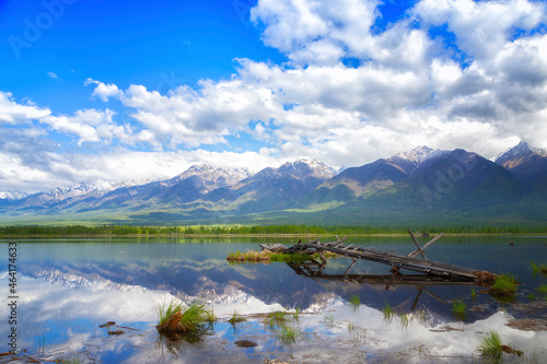 Landscape with mountains reflecting in the water on sunny day. Buryatia, Tunkinskaya valley photo