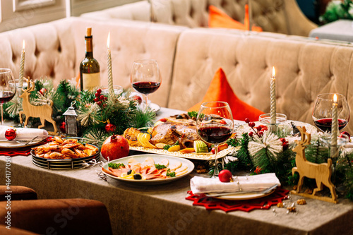 New Year festive served table with decorations and meal
