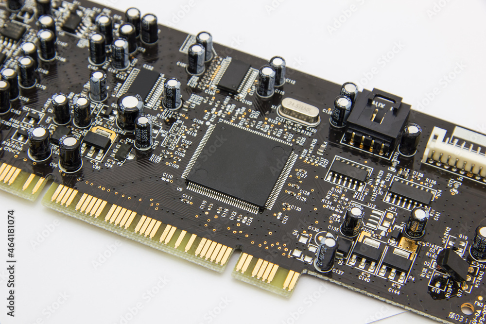 Selective focus. Close up photo of black printed circuit board with dip components. LED diods, resistors, capasitors and processor on the background Selective focus. Close up photo of black printed circuit board with dip components. LED diods, resistors, capasitors and processor on the background
