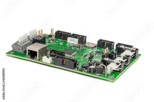 Isolated image of a green printed circuit board assembly. PCB production industry for microelectronics. Selective focus