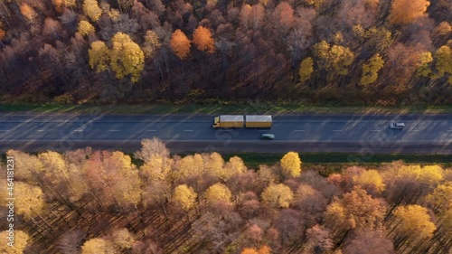 Delivery of refrigeration equipment for grocery stores. A truck with a double trailer moves towards the nearest city. Ride, track. High quality. 4k footage.