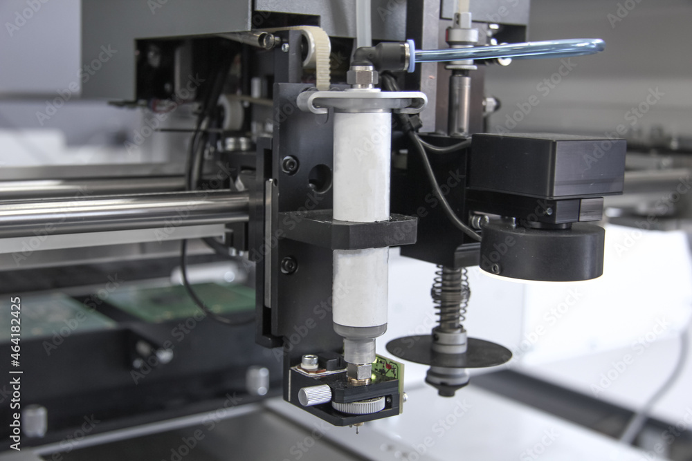 Factory for the electronic production. Technological process of soldering and assembly chip components on pcb board. Automated soldering machine inside Factory for the electronic production. Technological process of soldering and assembly chip components on pcb board. Automated soldering machine inside