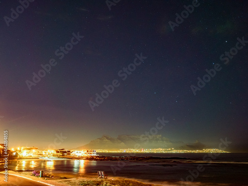 Night view of Table Mountain viewed from Big Bay Blouberg Cape Town, Western Cape, South Africa.