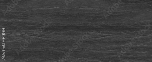 Abstract dark grey black slate background or the texture of the stone wall.