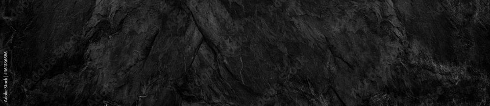Panorama dark gray stone background with copy space. Black grunge banner with rock texture. Panorama dark gray stone background with copy space. Black grunge banner with rock texture.