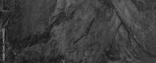Gray grunge banner. Abstract stone background. The texture of the stone wall. Close-up. © Nisathon Studio