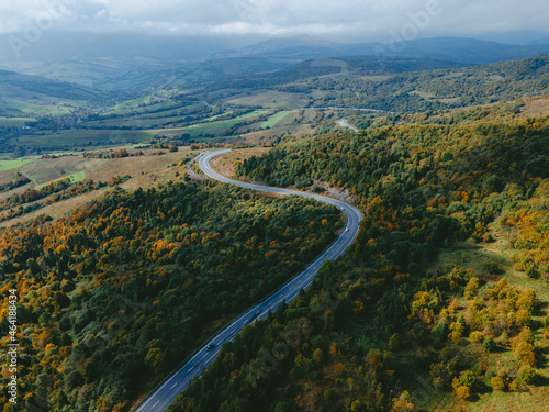 Fototapeta Naklejka Na Ścianę i Meble -  aerial view of speedway road in autumn carpathian mountains