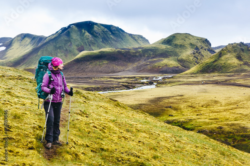 Active hiker enjoying the view on the trail in Landmannalaugar, Iceland