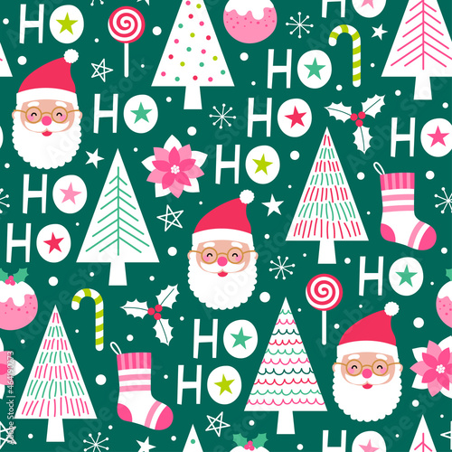 Cute santa claus, pine trees, christmas elements and word "HO HO HO" seamless pattern on green background.