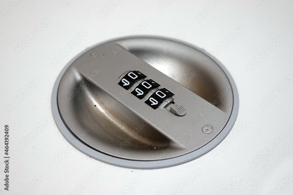Close-up of a combination dial on a file cabinet. combination lock on the safe closeup white Close-up of a combination dial on a file cabinet. combination lock on the safe closeup white