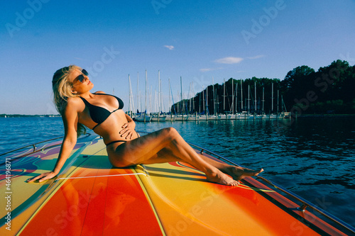 Beautiful Bikini Model Relaxing On A Boat photo