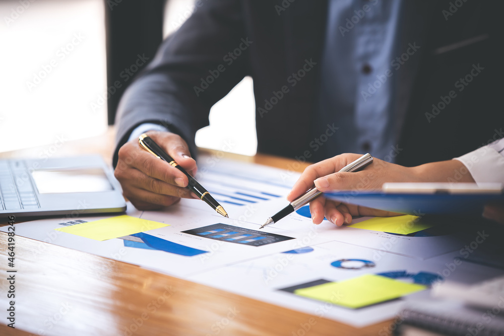 Team work with business analytic price chart on the table at the conference room. Team work with business analytic price chart on the table at the conference room.