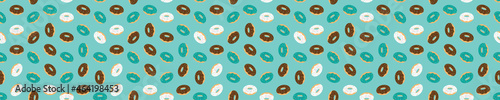 Blue seamless pattern with glazed donuts
