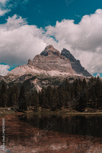 Lake and a Dolomites mountain top in background, South Tyrol, Italy.