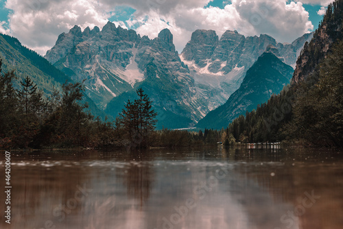 Lake and a Dolomites mountain top in background, South Tyrol, Italy.
