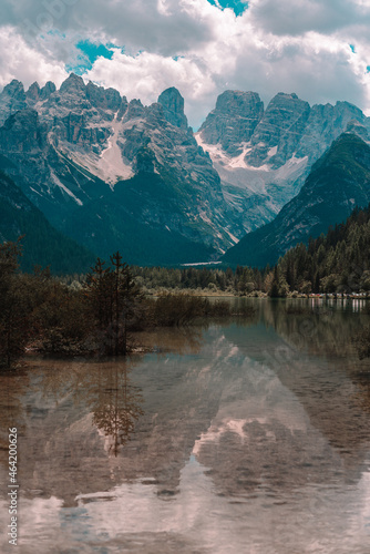 Lake and a Dolomites mountain top in background, South Tyrol, Italy.