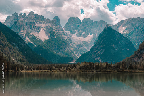 Lake and a Dolomites mountain top in background, South Tyrol, Italy.