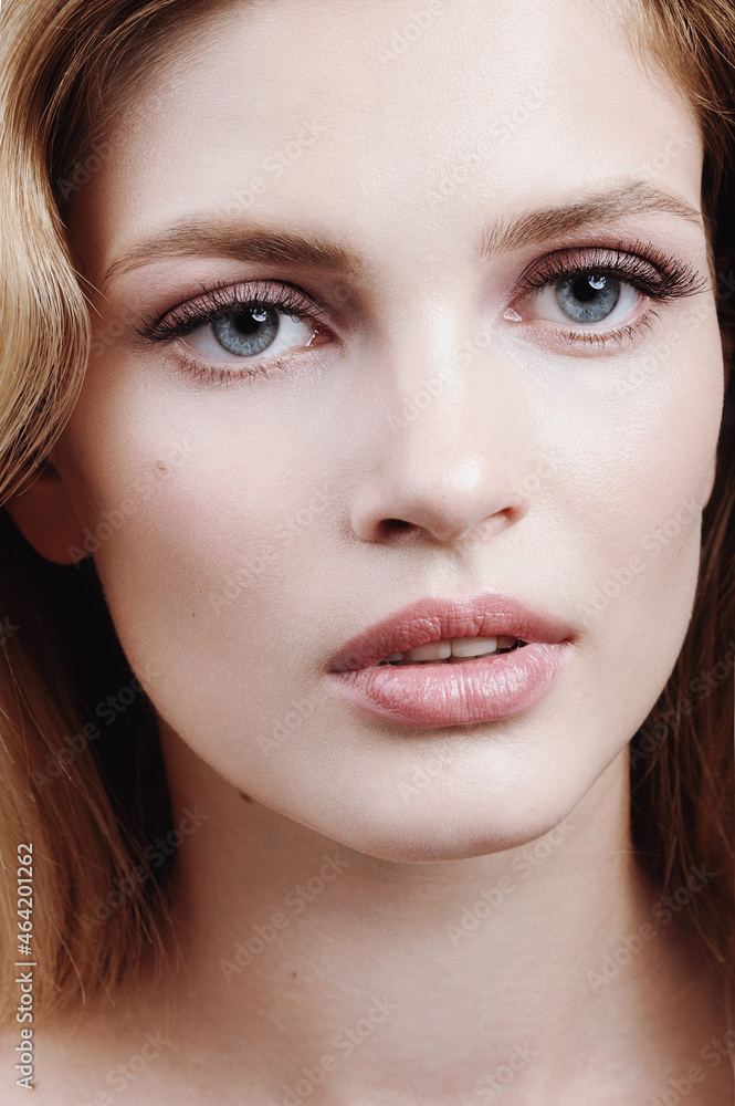 Close up portrait of young sensual woman with perfect skin and nude makeup Close up portrait of young sensual woman with perfect skin and nude makeup