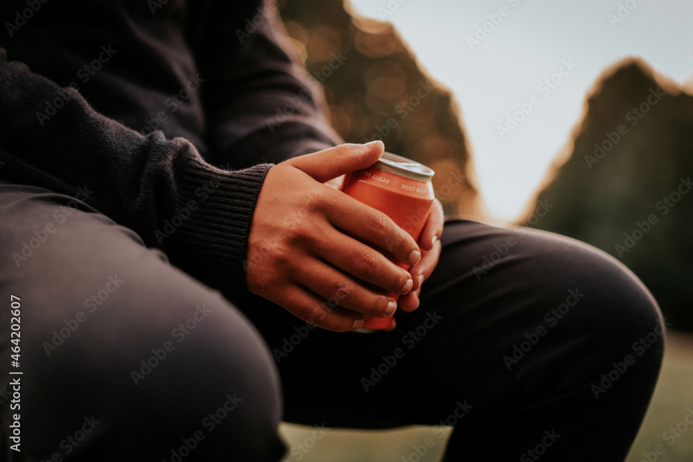 Man sitting and drinking alcohol outdoors Man sitting and drinking alcohol outdoors