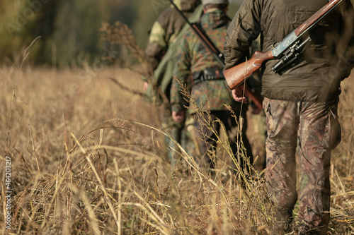 Group of hunters during hunting in the forest