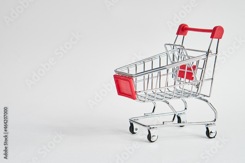 empty trolley on light background shopping supermarket service