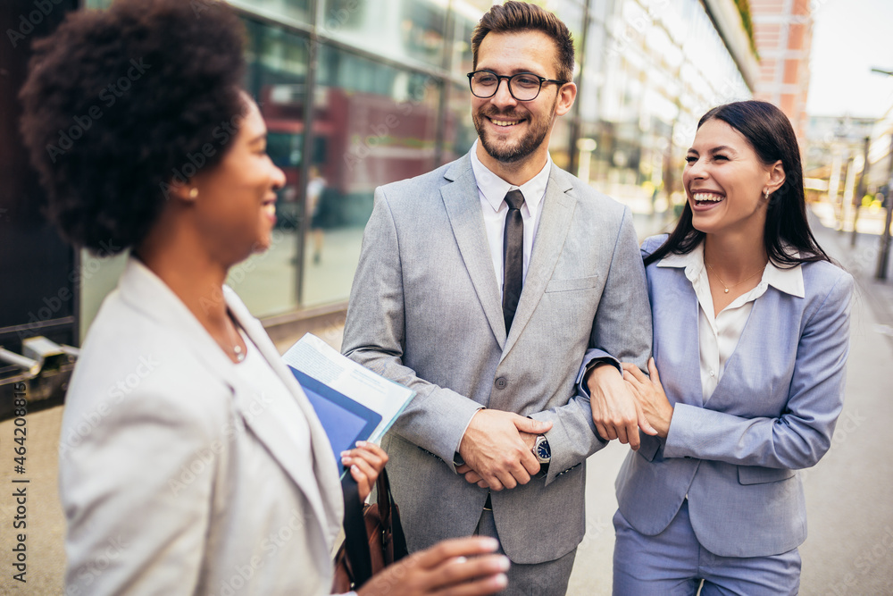 Couple meeting real estate agent outside new property Couple meeting real estate agent outside new property