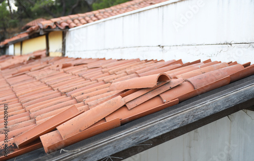 Clay tile roof damage  some fallen tiles