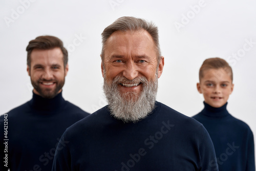 Portrait of happy mature grandfather with son and grandson