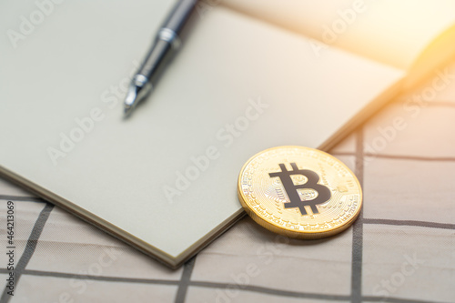 Wallpaper Mural Bitcoin Cryptocurrency golden coin on blank notebook on white table with copy space. Bitcoin Cryptocurrency is future digital money currency on Blockchain technology as other Cryptcurrency as Ethereum Torontodigital.ca
