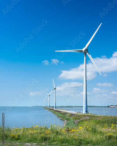 wind turbines near enkhuizen in holland under blue summer sky