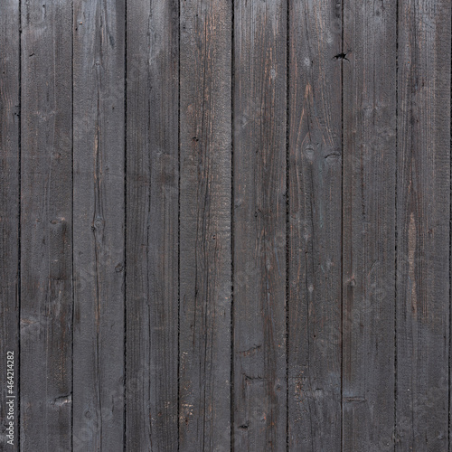dark brown background of vertical wooden old grungy painted planks