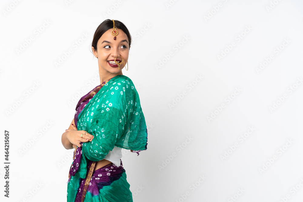 Young indian woman isolated on white background with arms crossed and happy