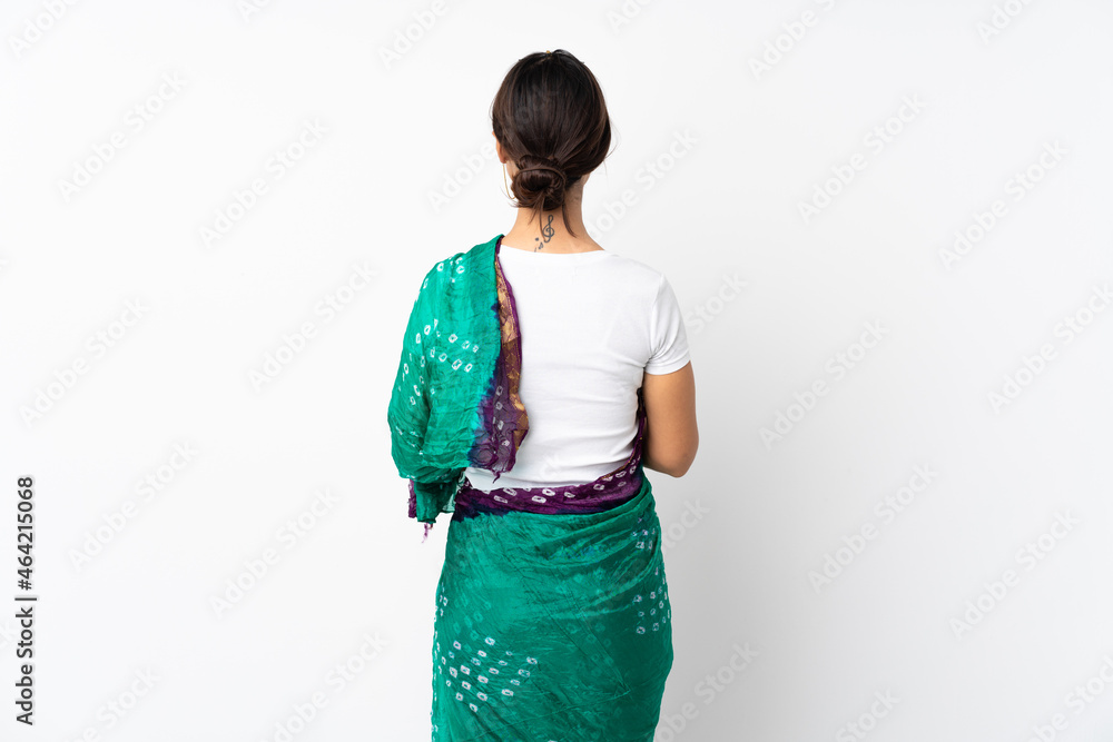 Young indian woman isolated on white background in back position Young indian woman isolated on white background in back position