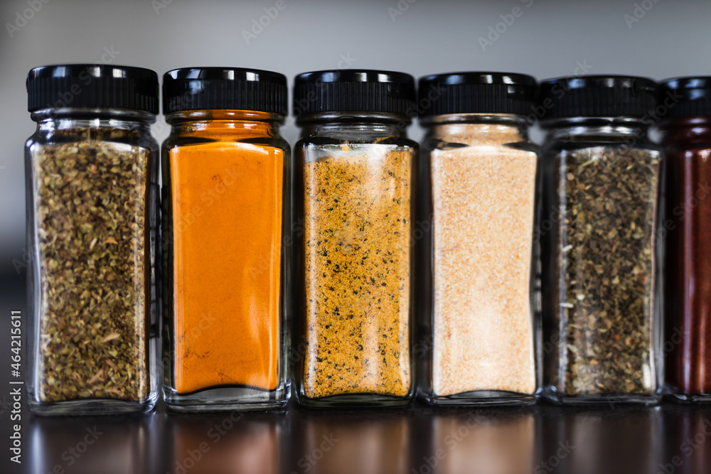 spices seeds and seasonings in mathing spice jars on tidy pantry shelf, simple vegan ingredients and flavoring your dishes spices seeds and seasonings in mathing spice jars on tidy pantry shelf, simple vegan ingredients and flavoring your dishes