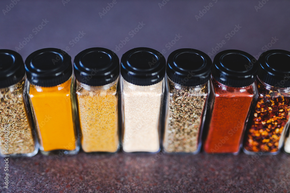 spices seeds and seasonings in mathing spice jars on tidy pantry shelf, simple vegan ingredients and flavoring your dishes spices seeds and seasonings in mathing spice jars on tidy pantry shelf, simple vegan ingredients and flavoring your dishes