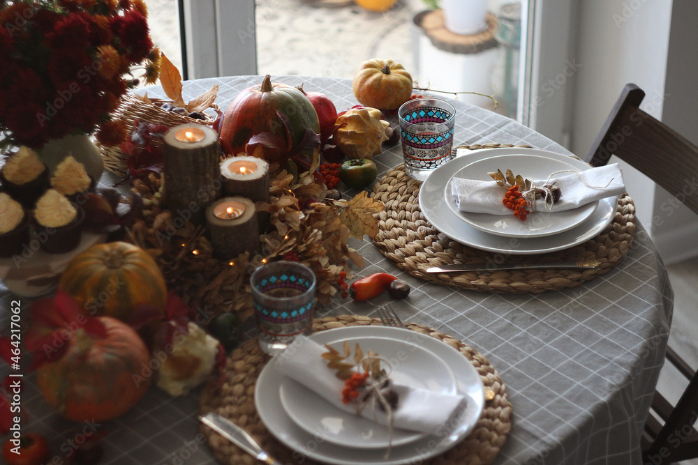 Festive autumn table setting with pumpkin