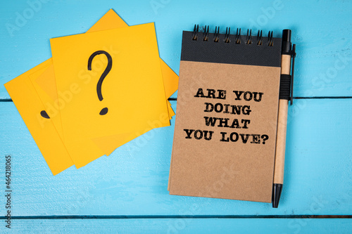 Are you doing what you love. Notebook on the table. Inspirational question