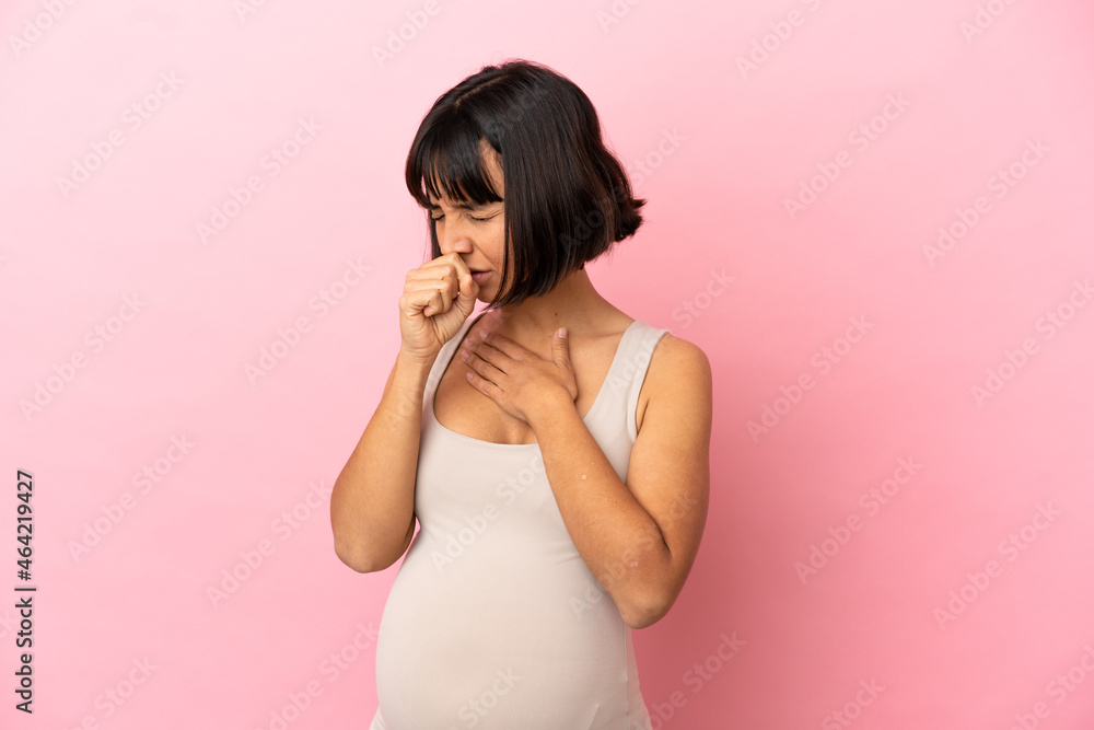 Young pregnant woman over isolated pink background coughing a lot
