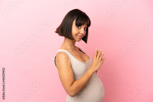 Wallpaper Mural Young pregnant woman over isolated pink background scheming something Torontodigital.ca