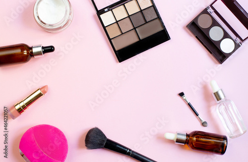 top view of womens cosmetics cream and hyaluronic acid on pink background