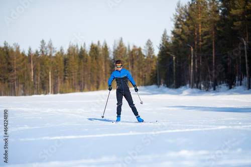 Athlete skier man finishes cross country skiing winter stadium