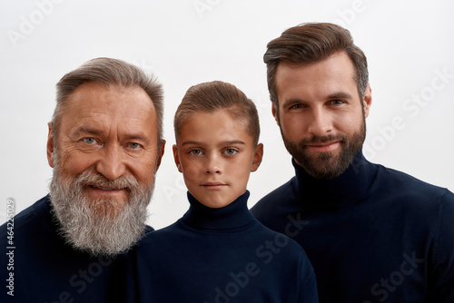 Portrait of happy three generations of men together