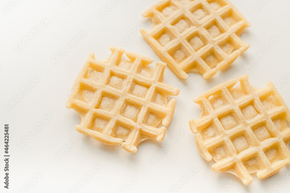 Waffles on a white background. Homemade waffles. Waffles on a white background. Homemade waffles.