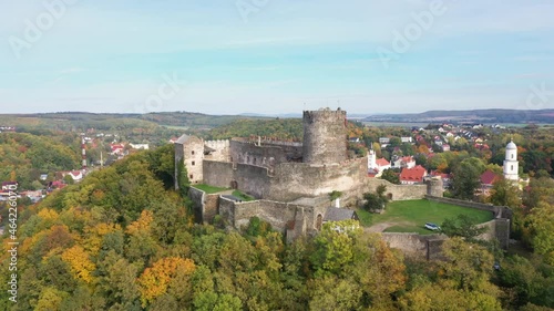 Aerial view of Bolkow Castle surrounded by yellow autumn trees, Lower Silesia, Poland
 photo